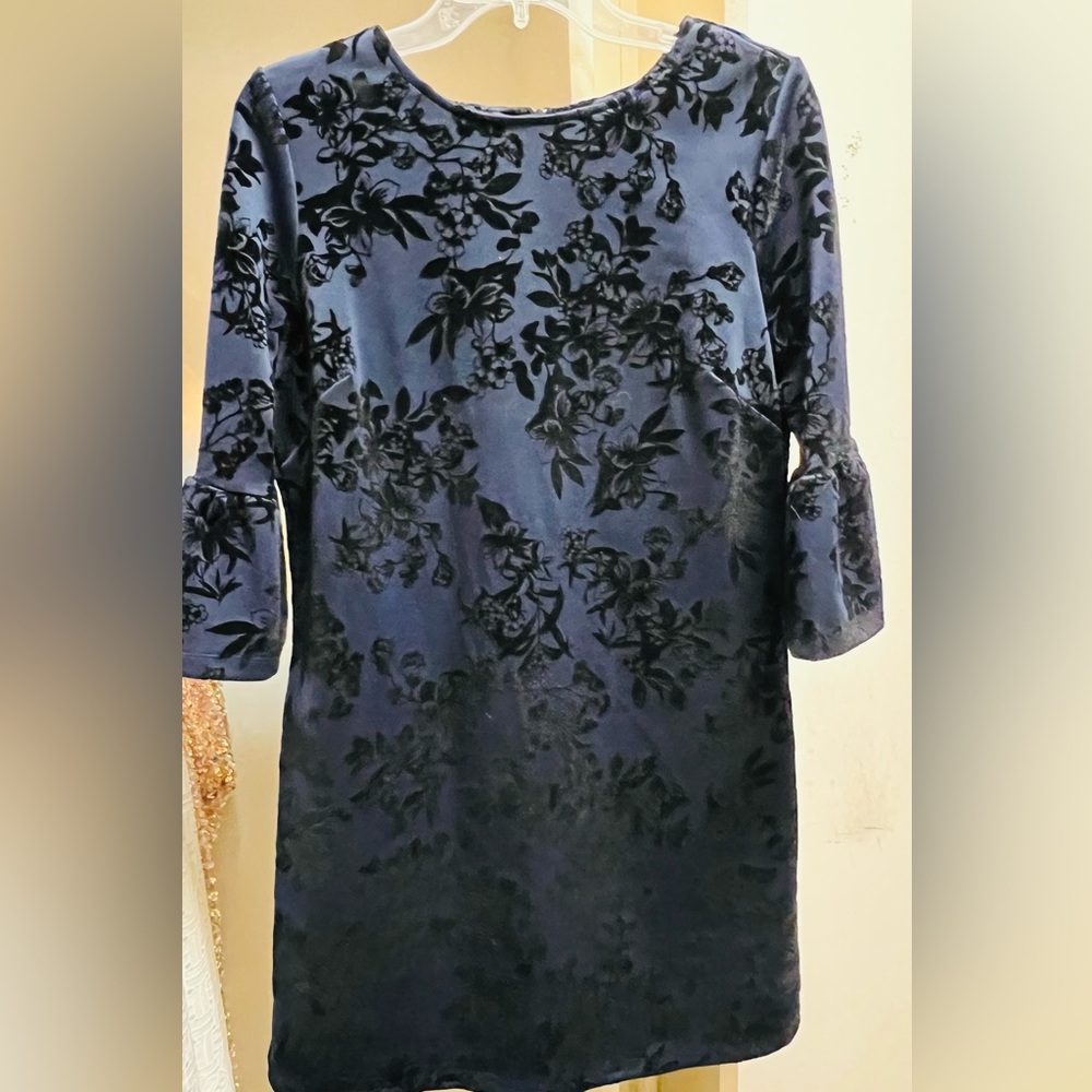 NEW: Women’s navy blue and black peplum long sleeve dress.